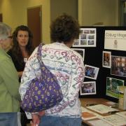 Patrons speaking with vendor at Senior Expo