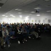 Packed house for a presentation, view from front