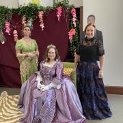 Photograph of three participants dressed in fancy clothing.