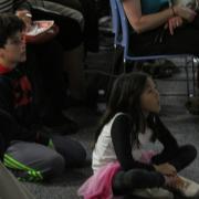 Child listening attentively to presentation