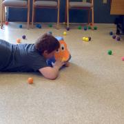 Boy playing the Hungry Hungry Hippos game 