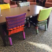 Crocheted chairs around table