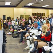 Cosplayers onstage demonstrating for audience 