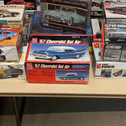 Photograph of boxes of model cars on a table.