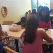 Young patrons write during the poetry workshop