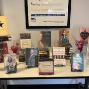 A display table featured a curated mix of fiction and non-fiction books about Hamilton and other Founding Fathers.