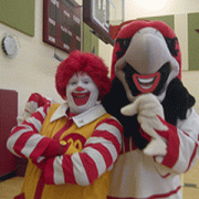 Ronald McDonald and Swoop the Redhawk mascots pose for a photo 