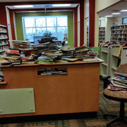 Books piled high at the library media center