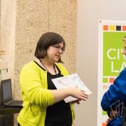 A librarian discusses the Civic Lab topic with a patron. 