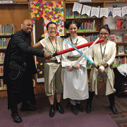 Library workers dressed up in Star Wars themed costumes