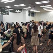 Room full of people trading clothing