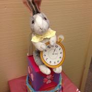 Stuffed white rabbit with watch decoration