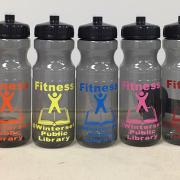 five water bottles and two sets of dumbbells 