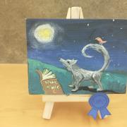 Photo of art canvas with painting of wolf
