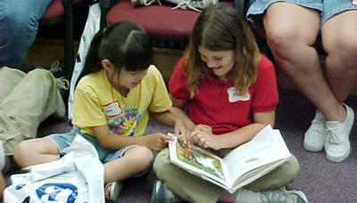 Two girls reading