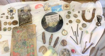 A display case of surviving remnants sits in the library for visitors to view.