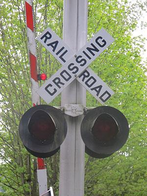A rail crossing at the Cross Kirkland Corridor, a former railroad right of way extending through the entire city of Kirkland, Washington (Elsa Steele)