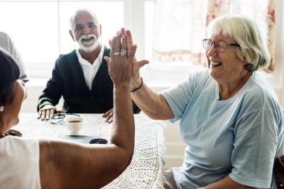 Older adults touching palms