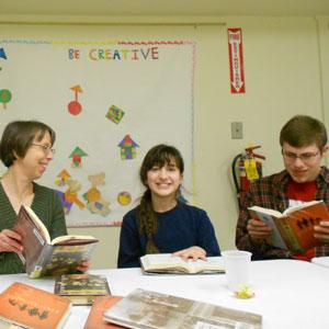 Teens and adults participate in an intergenerational book discussion—with dessert!—at the Burnham Memorial Library in Colchester, Vermont.