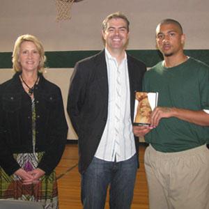 Library media specialist Francie Clinton and author Coert Voorhees pose with a Great Stories CLUB participant at the Southwest Oklahoma Juvenile Center in November 2011.