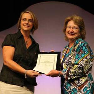 Sally Rasch (r), accepting the 2009 Jaffarian Award from Lisa Hathcock (l), award selection committee chair.