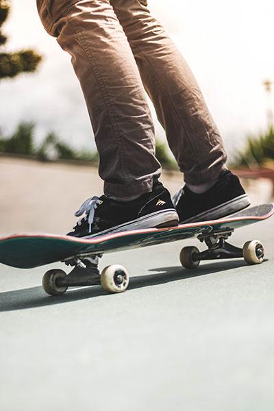 Person riding skateboard on the road