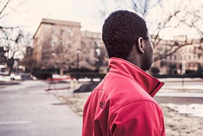 Young man looks out over street