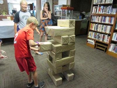 People playing life-sized Jenga