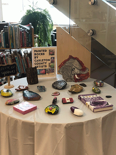 A table with painted rocks on it