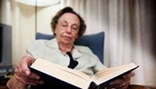 Old woman reading a book