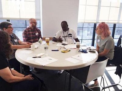 Group of people sitting at a round table