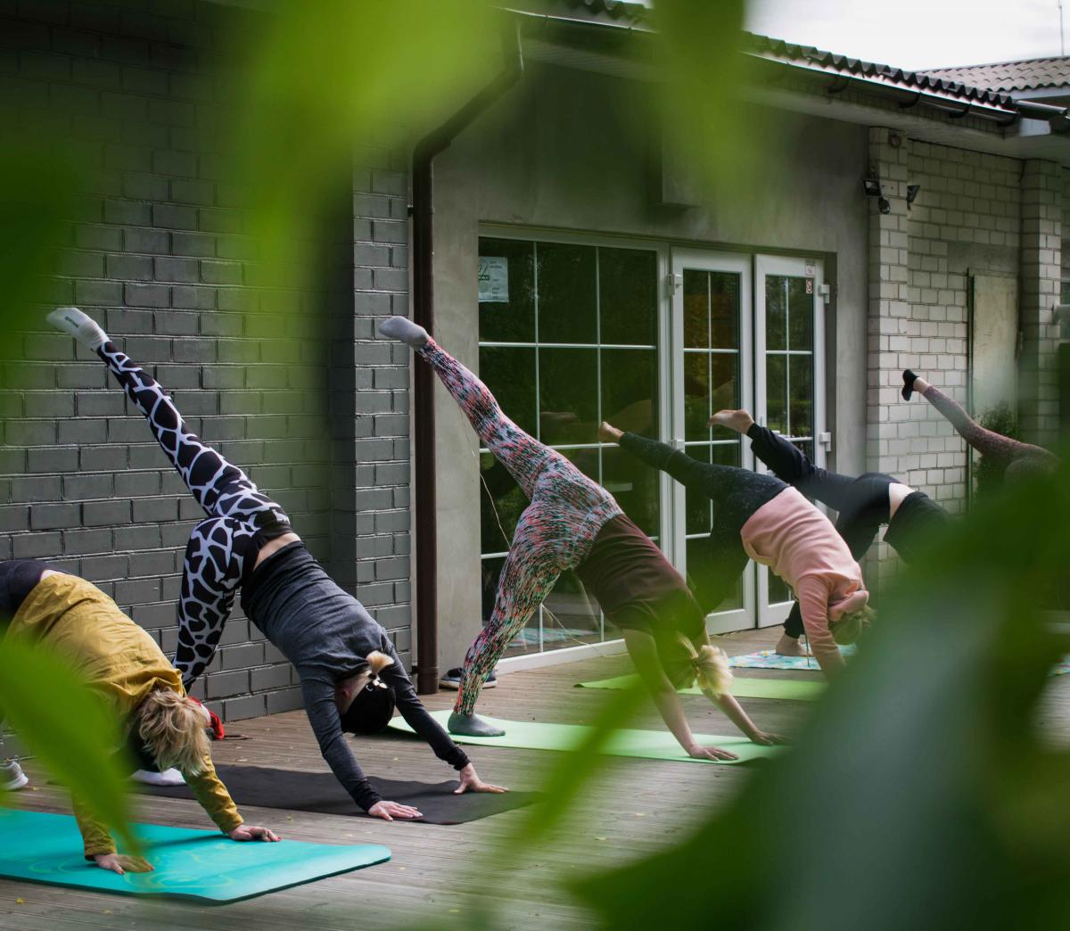 Women doing yoga outdoors 